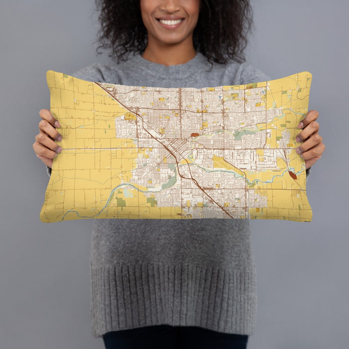 Person holding 20x12 Custom Modesto California Map Throw Pillow in Woodblock