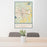24x36 Monroe Louisiana Map Print Portrait Orientation in Woodblock Style Behind 2 Chairs Table and Potted Plant
