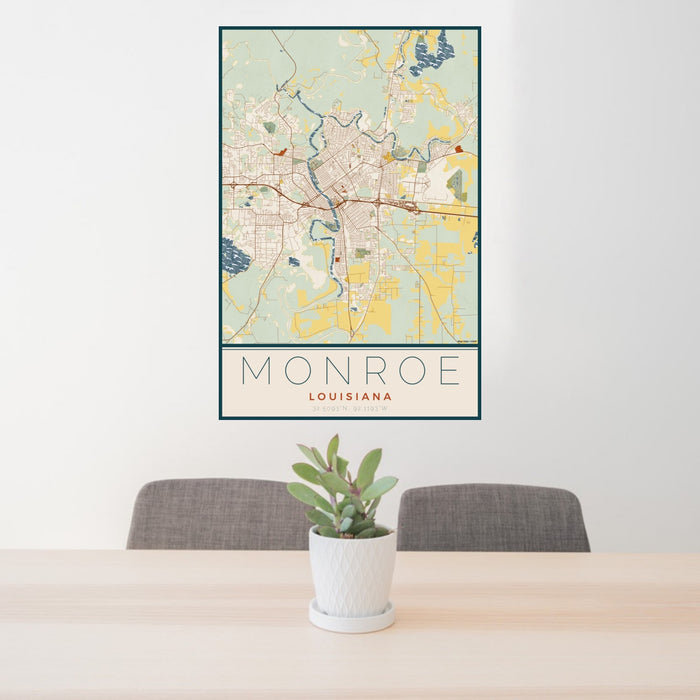 24x36 Monroe Louisiana Map Print Portrait Orientation in Woodblock Style Behind 2 Chairs Table and Potted Plant