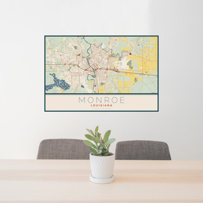 24x36 Monroe Louisiana Map Print Landscape Orientation in Woodblock Style Behind 2 Chairs Table and Potted Plant
