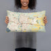 Person holding 20x12 Custom Monroe Louisiana Map Throw Pillow in Woodblock