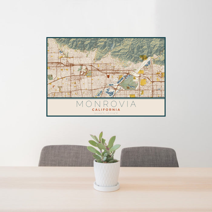 24x36 Monrovia California Map Print Lanscape Orientation in Woodblock Style Behind 2 Chairs Table and Potted Plant