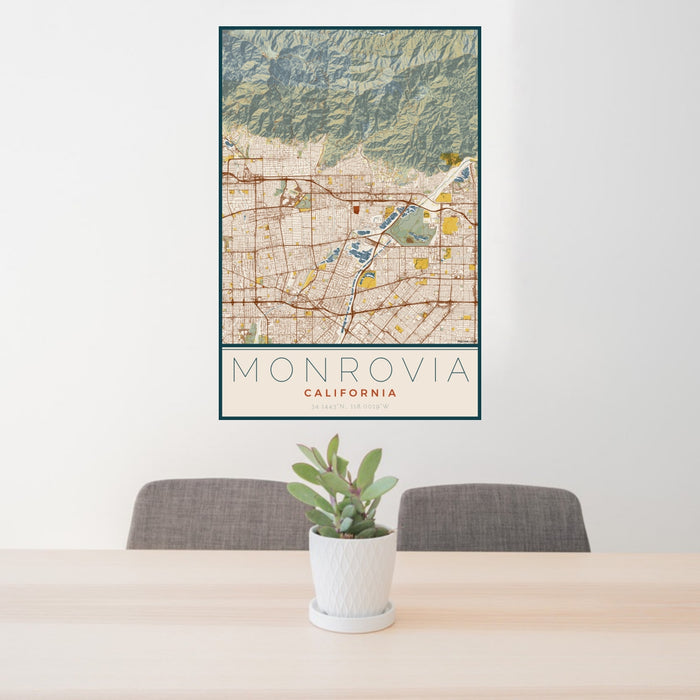 24x36 Monrovia California Map Print Portrait Orientation in Woodblock Style Behind 2 Chairs Table and Potted Plant