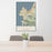 24x36 Monterey California Map Print Portrait Orientation in Woodblock Style Behind 2 Chairs Table and Potted Plant