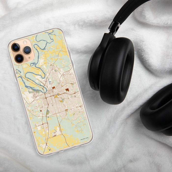 Custom Montgomery Alabama Map Phone Case in Woodblock on Table with Black Headphones