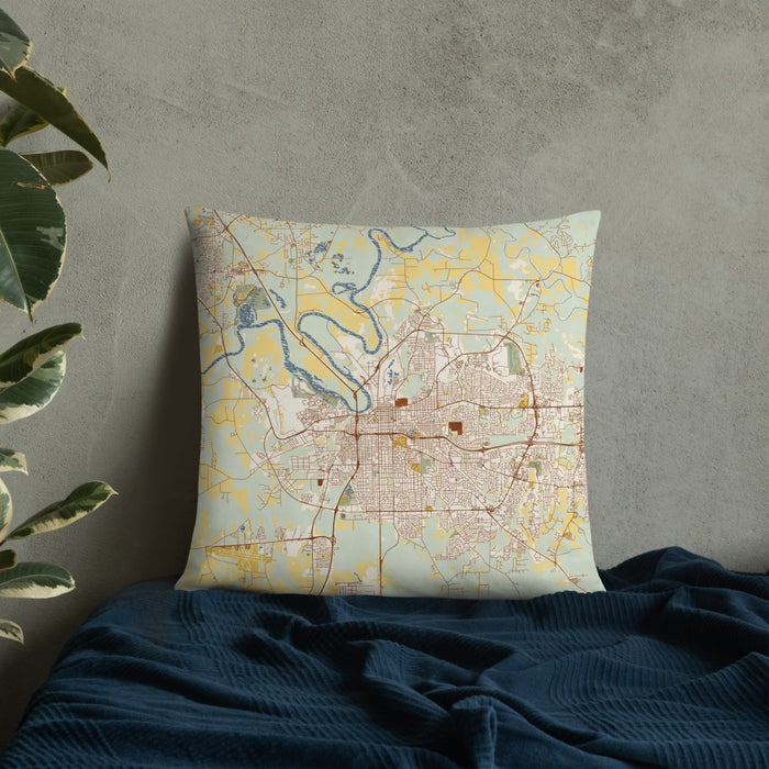 Custom Montgomery Alabama Map Throw Pillow in Woodblock on Bedding Against Wall