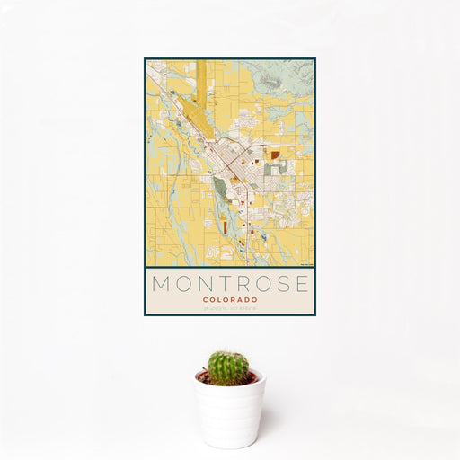 12x18 Montrose Colorado Map Print Portrait Orientation in Woodblock Style With Small Cactus Plant in White Planter