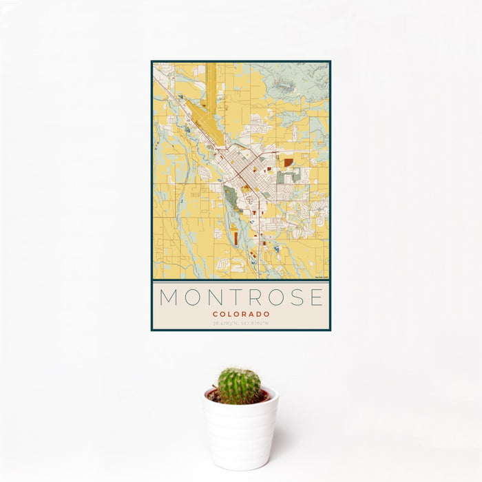 12x18 Montrose Colorado Map Print Portrait Orientation in Woodblock Style With Small Cactus Plant in White Planter
