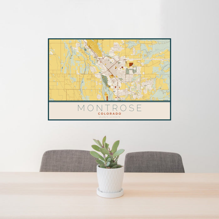 24x36 Montrose Colorado Map Print Landscape Orientation in Woodblock Style Behind 2 Chairs Table and Potted Plant