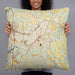 Person holding 22x22 Custom Mooresville North Carolina Map Throw Pillow in Woodblock
