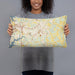 Person holding 20x12 Custom Mooresville North Carolina Map Throw Pillow in Woodblock