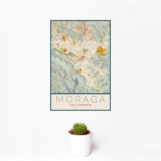 12x18 Moraga California Map Print Portrait Orientation in Woodblock Style With Small Cactus Plant in White Planter