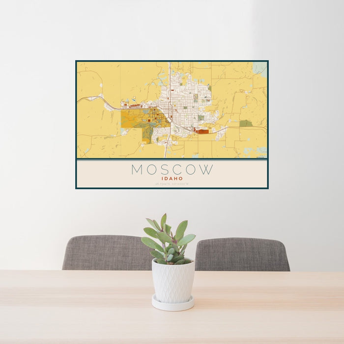 24x36 Moscow Idaho Map Print Landscape Orientation in Woodblock Style Behind 2 Chairs Table and Potted Plant