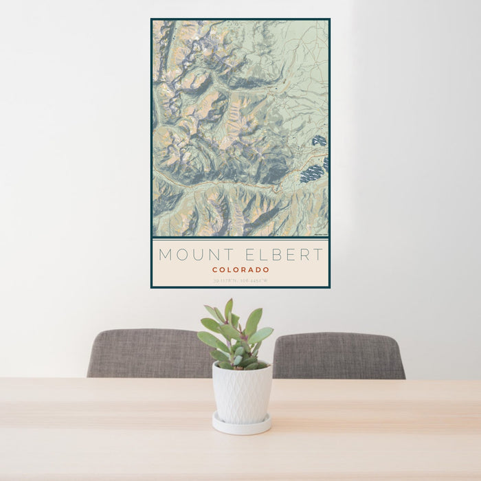 24x36 Mount Elbert Colorado Map Print Portrait Orientation in Woodblock Style Behind 2 Chairs Table and Potted Plant
