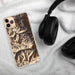 Custom Mount Elbert Colorado Map Phone Case in Ember on Table with Black Headphones