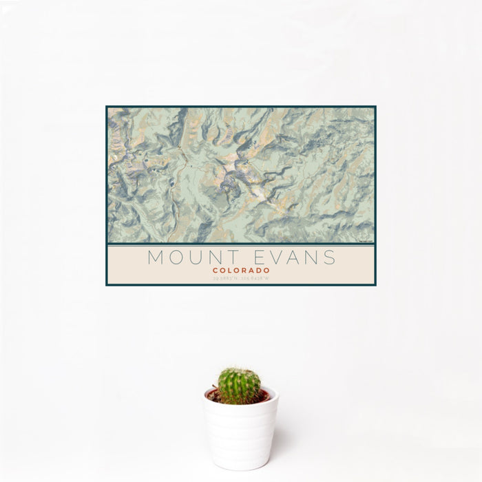 12x18 Mount Evans Colorado Map Print Landscape Orientation in Woodblock Style With Small Cactus Plant in White Planter