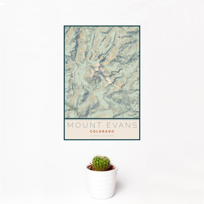 12x18 Mount Evans Colorado Map Print Portrait Orientation in Woodblock Style With Small Cactus Plant in White Planter