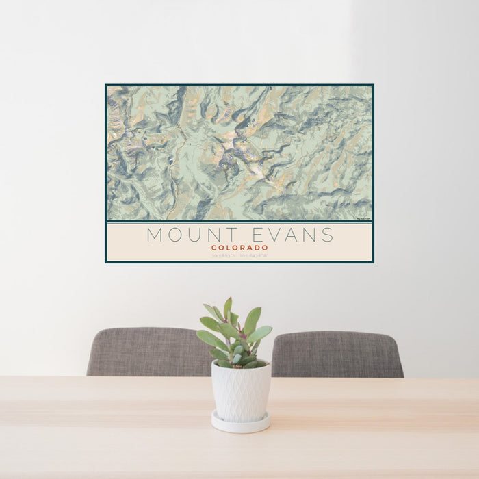 24x36 Mount Evans Colorado Map Print Lanscape Orientation in Woodblock Style Behind 2 Chairs Table and Potted Plant