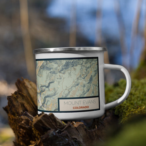 Right View Custom Mount Evans Colorado Map Enamel Mug in Woodblock on Grass With Trees in Background