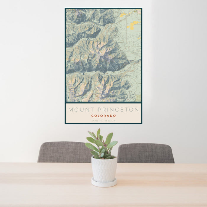 24x36 Mount Princeton Colorado Map Print Portrait Orientation in Woodblock Style Behind 2 Chairs Table and Potted Plant