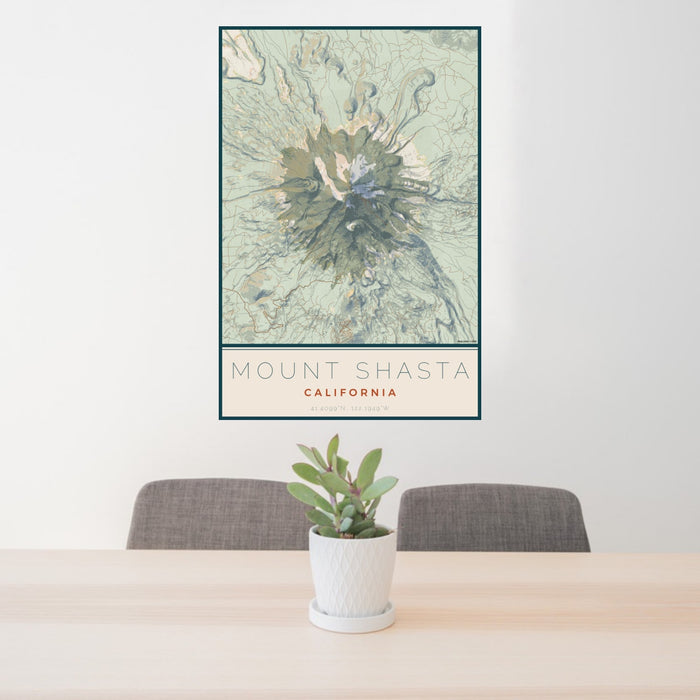 24x36 Mount Shasta California Map Print Portrait Orientation in Woodblock Style Behind 2 Chairs Table and Potted Plant