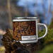 Right View Custom Mount Vernon Illinois Map Enamel Mug in Ember on Grass With Trees in Background