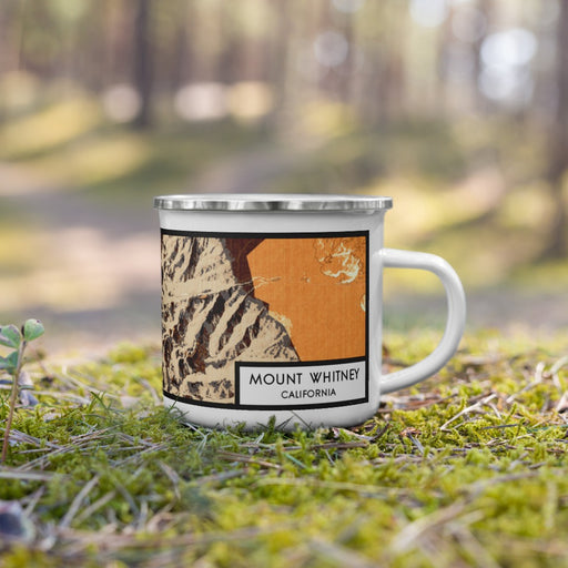 Right View Custom Mount Whitney California Map Enamel Mug in Ember on Grass With Trees in Background