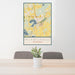24x36 Mukwonago Wisconsin Map Print Portrait Orientation in Woodblock Style Behind 2 Chairs Table and Potted Plant