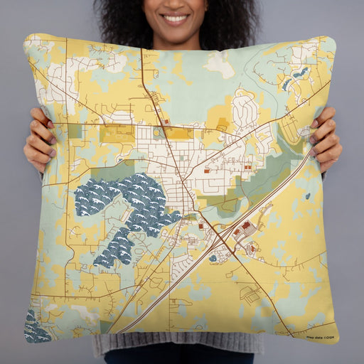 Person holding 22x22 Custom Mukwonago Wisconsin Map Throw Pillow in Woodblock