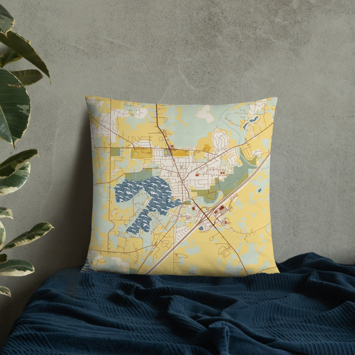 Custom Mukwonago Wisconsin Map Throw Pillow in Woodblock on Bedding Against Wall