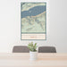 24x36 Multnomah Falls Oregon Map Print Portrait Orientation in Woodblock Style Behind 2 Chairs Table and Potted Plant