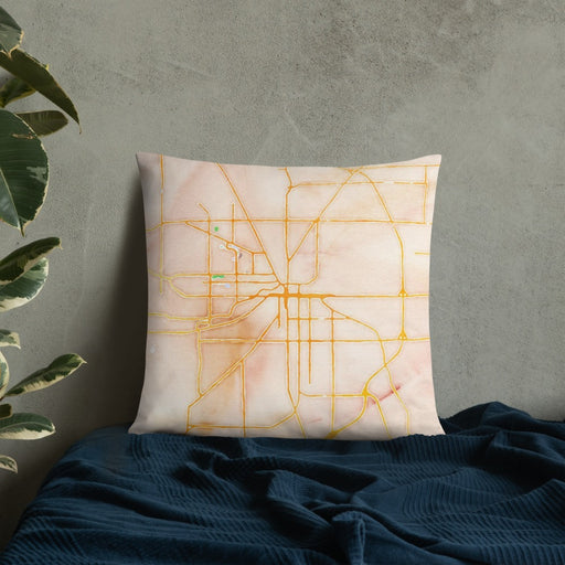 Custom Muncie Indiana Map Throw Pillow in Watercolor on Bedding Against Wall