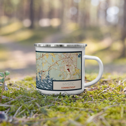 Right View Custom Mystic Connecticut Map Enamel Mug in Woodblock on Grass With Trees in Background