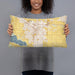 Person holding 20x12 Custom Nampa Idaho Map Throw Pillow in Woodblock