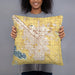 Person holding 18x18 Custom Nampa Idaho Map Throw Pillow in Woodblock
