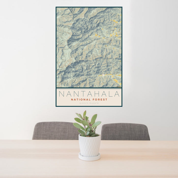 24x36 Nantahala National Forest Map Print Portrait Orientation in Woodblock Style Behind 2 Chairs Table and Potted Plant