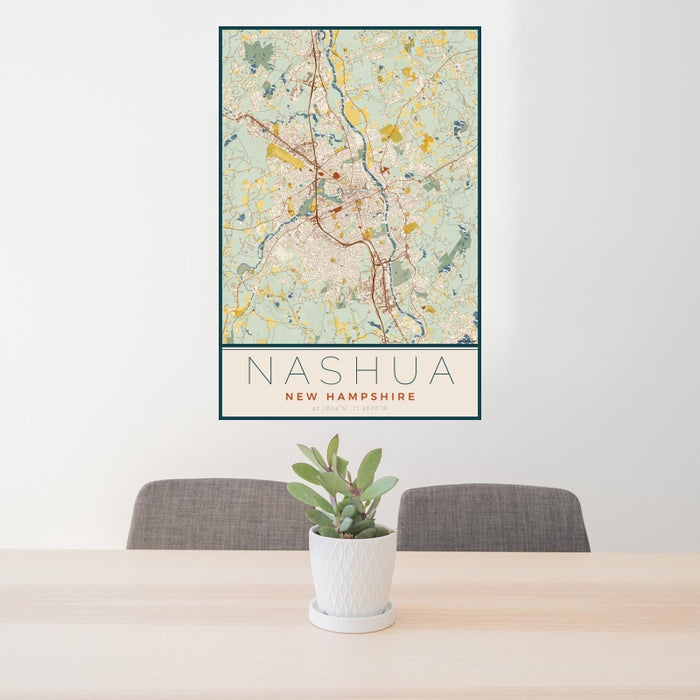 24x36 Nashua New Hampshire Map Print Portrait Orientation in Woodblock Style Behind 2 Chairs Table and Potted Plant