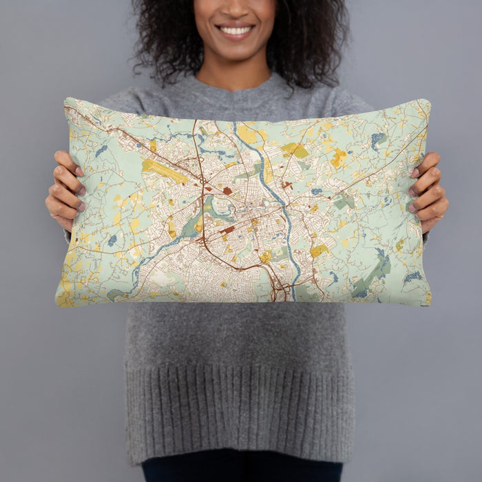 Person holding 20x12 Custom Nashua New Hampshire Map Throw Pillow in Woodblock