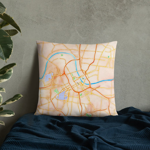 Custom Nashville Tennessee Map Throw Pillow in Watercolor on Bedding Against Wall