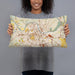 Person holding 20x12 Custom Nashville Tennessee Map Throw Pillow in Woodblock