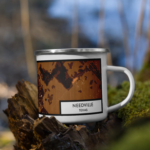 Right View Custom Needville Texas Map Enamel Mug in Ember on Grass With Trees in Background