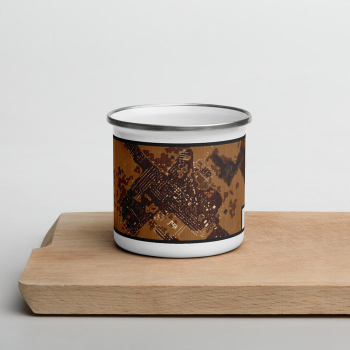 Front View Custom Needville Texas Map Enamel Mug in Ember on Cutting Board