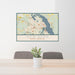 24x36 New Bern North Carolina Map Print Lanscape Orientation in Woodblock Style Behind 2 Chairs Table and Potted Plant