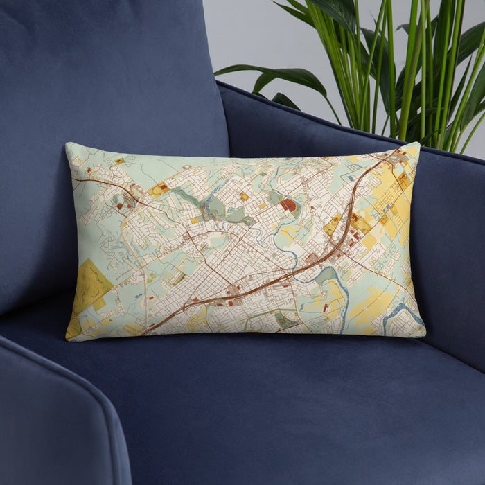 Custom New Braunfels Texas Map Throw Pillow in Woodblock on Blue Colored Chair