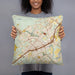 Person holding 18x18 Custom New Braunfels Texas Map Throw Pillow in Woodblock