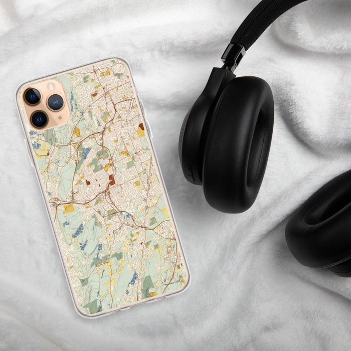 Custom New Britain Connecticut Map Phone Case in Woodblock on Table with Black Headphones