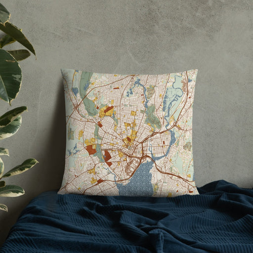 Custom New Haven Connecticut Map Throw Pillow in Woodblock on Bedding Against Wall
