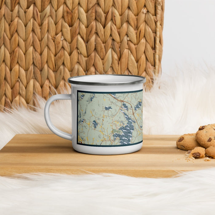 Left View Custom New London New Hampshire Map Enamel Mug in Woodblock on Table Top