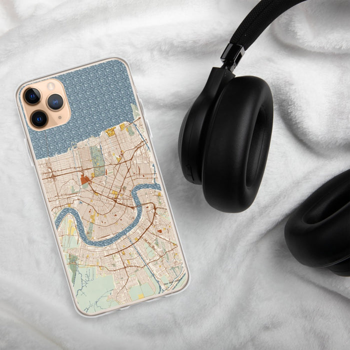 Custom New Orleans Louisiana Map Phone Case in Woodblock on Table with Black Headphones