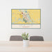 24x36 New Ulm Minnesota Map Print Lanscape Orientation in Woodblock Style Behind 2 Chairs Table and Potted Plant